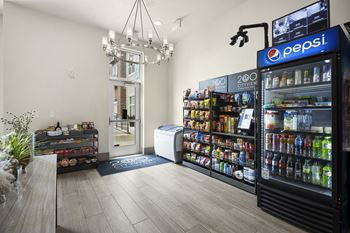 A store with a large display of drinks and a vending machine in